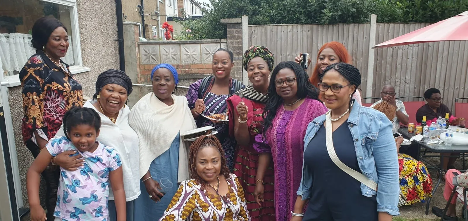 Women of the Association smiling together in a garden